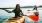 a woman and a man in kayaks on a lake