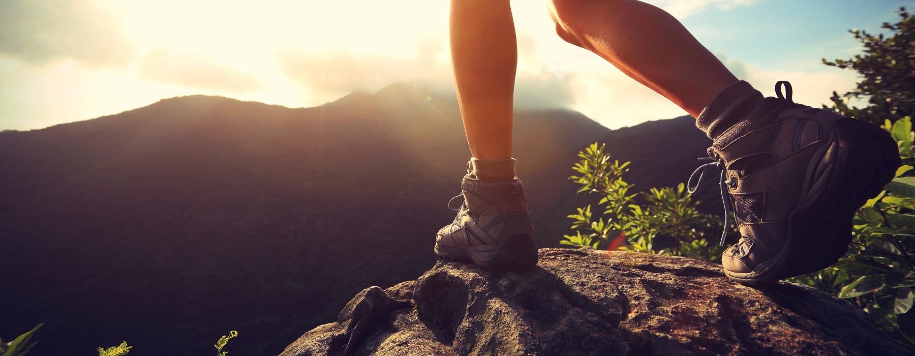 a person standing on a rock