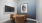 lighted confrence room with wall mounted tv