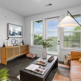 Generous living spaces with beautiful natural lighting large, furnished living room