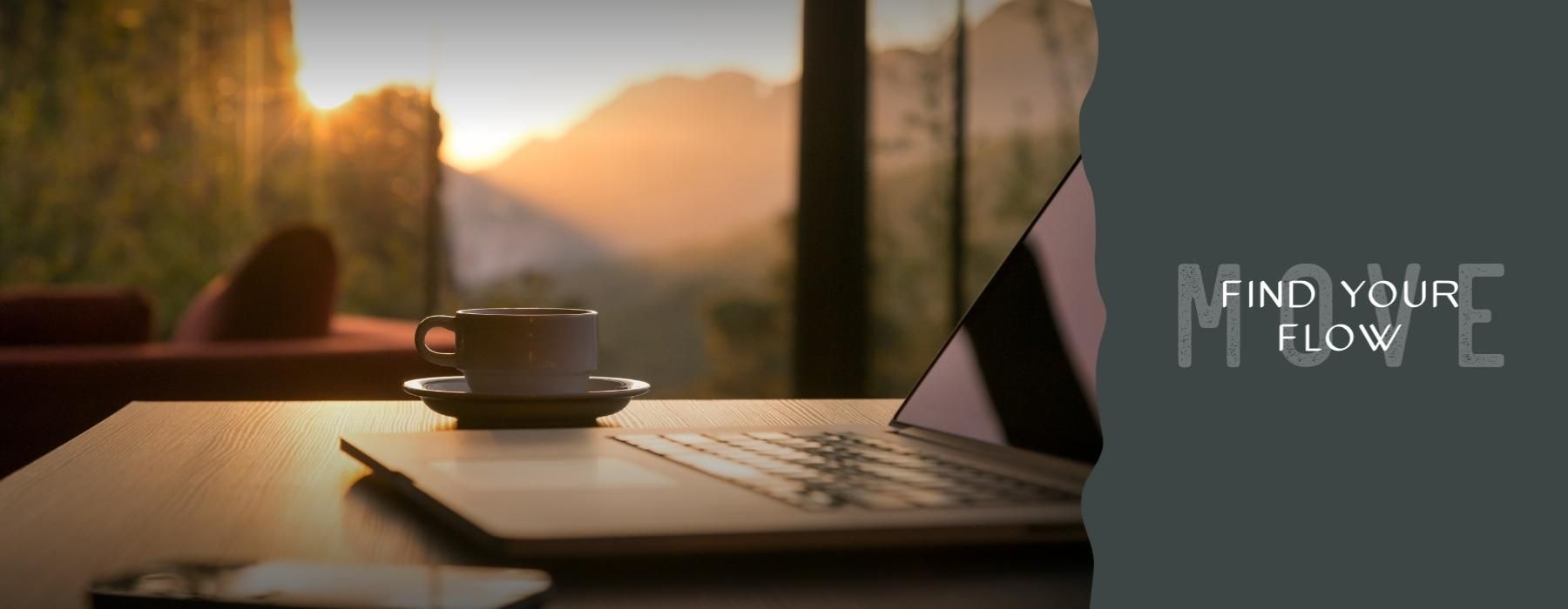 a laptop and a cup of coffee on a table